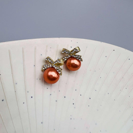 Amber Pearl Bow Stud Earrings