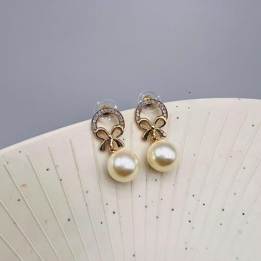 Dainty Pearl Earrings with Crystal Bow